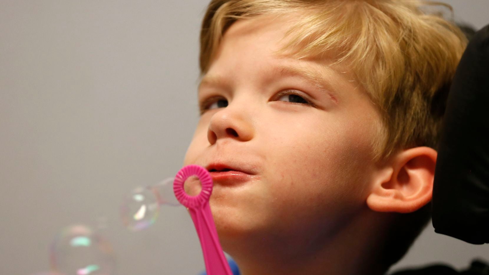 Will blows bubbles at Keystone Pediatric Therapy in McKinney, Texas, Wednesday, June 20, 2018.