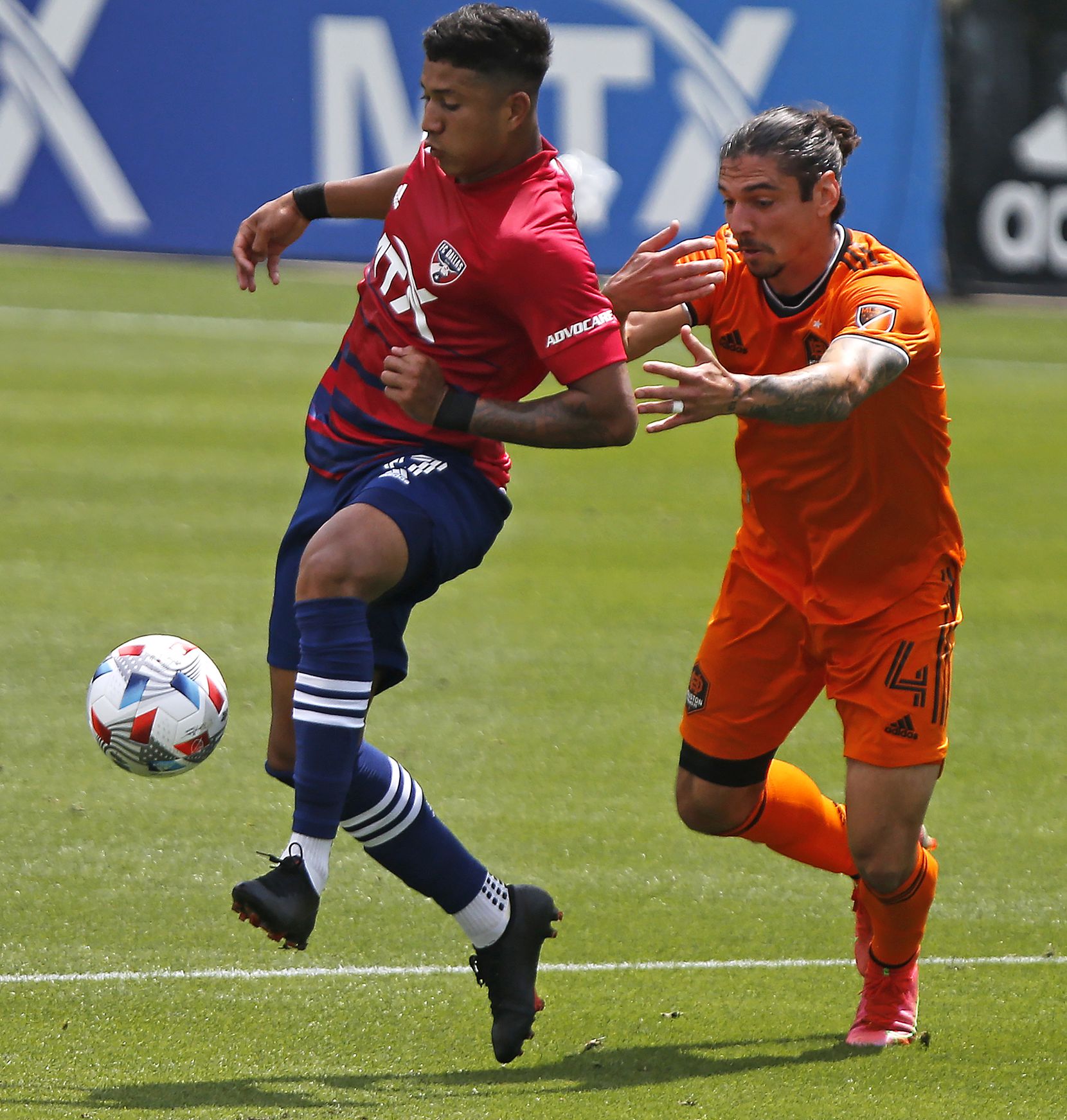 FC Dallas midfielder Freddy Vargas (17) makes a pass in front of Houston Dynamo defender...