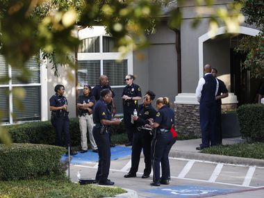 Dallas police investigate where two children and two adults were found shot to death at a Staybridge Suites near Keller Springs Road and the Dallas North Tollway on Tuesday, March 10, 2020 in Dallas. (Ryan Michalesko/The Dallas Morning News)