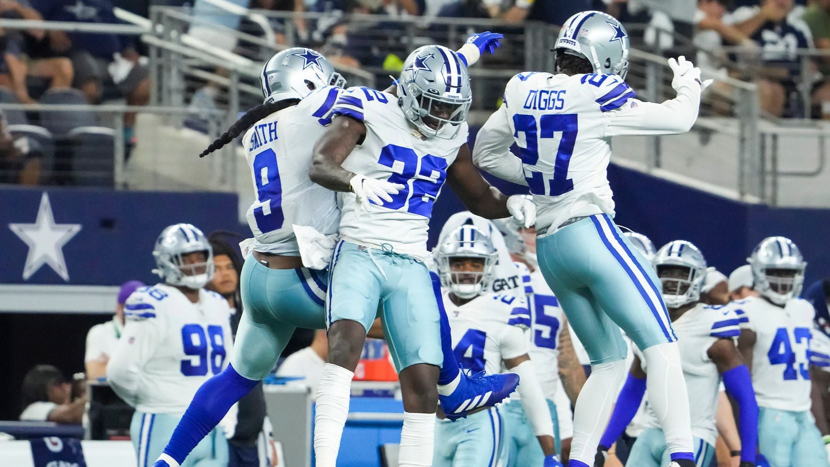 Dallas Cowboys safety Jayron Kearse (32) celebrates a defensive stop with linebacker Jaylon Smith (9) ad cornerback Trevon Diggs (27) during the first half of a preseason NFL football game against the Houston Texans at AT&T Stadium on Saturday, Aug. 21, 2021, in Arlington. 