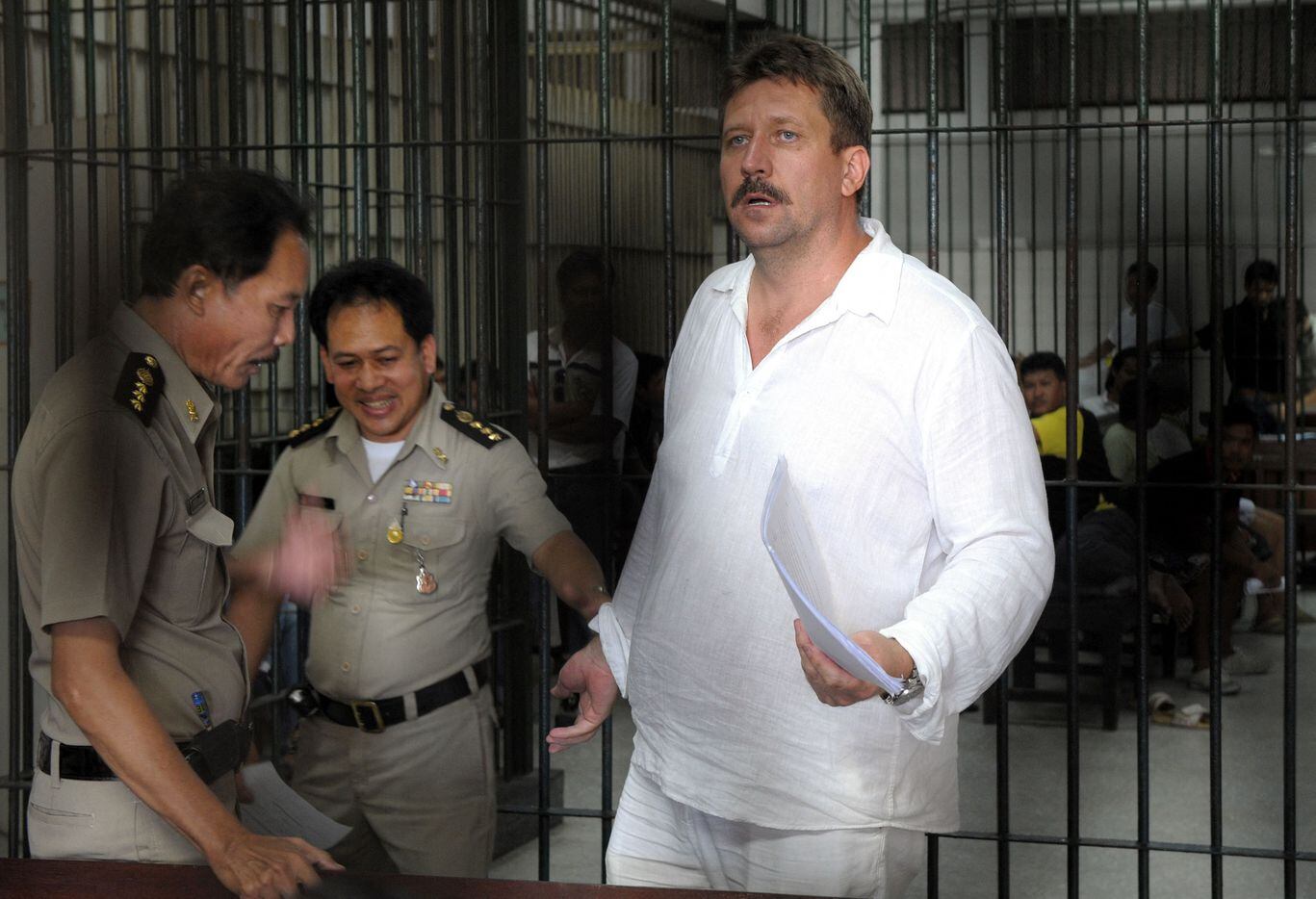In this file photo taken on April 9, 2008 Thai police officers take away Russian arms dealer...