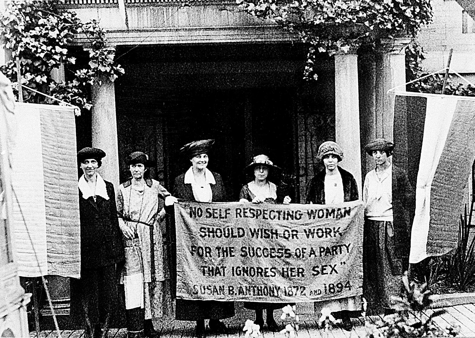 Chairwoman Alice Paul (second from left) and officers of the National Woman's Party hold a...