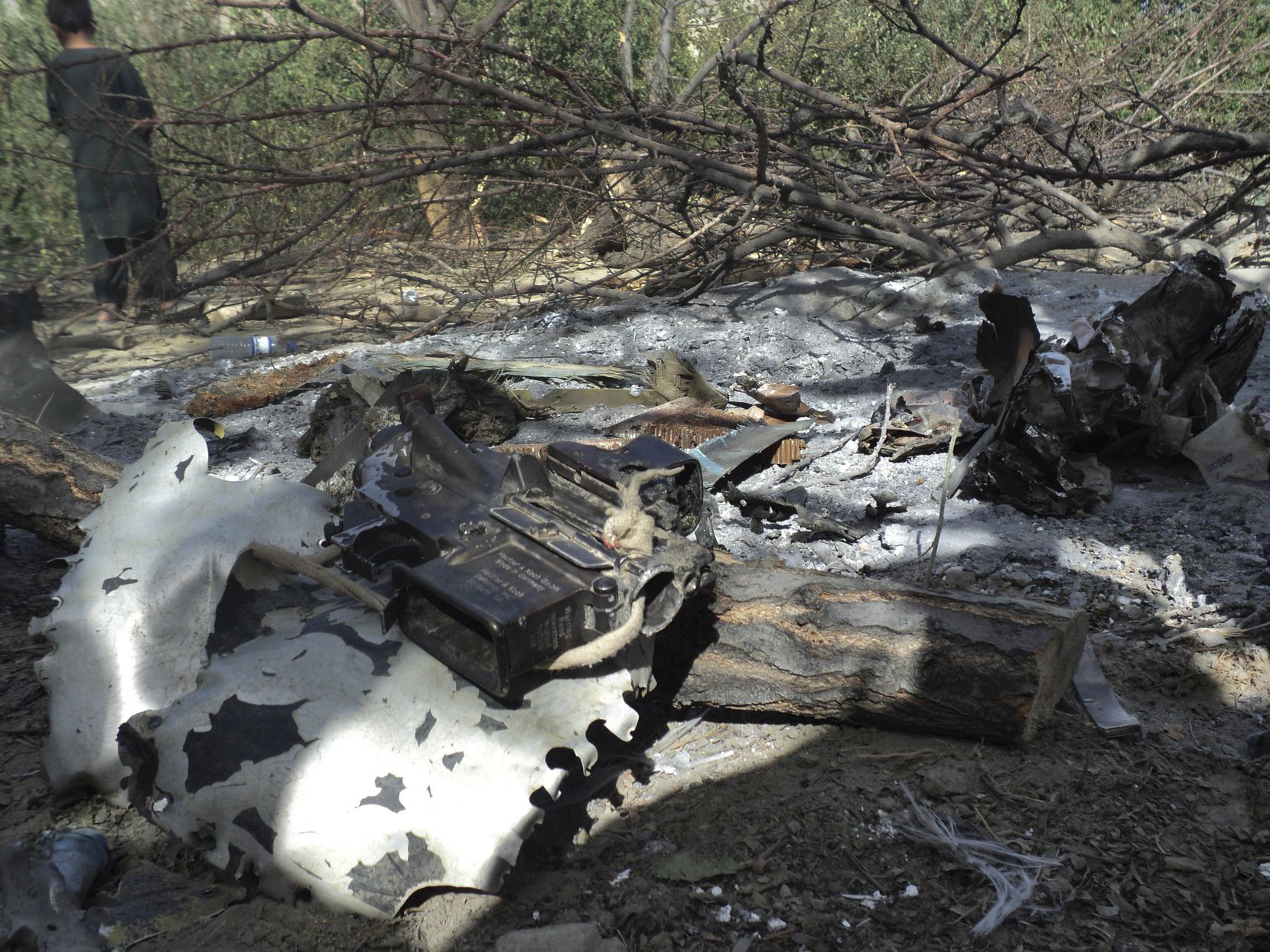 Wreckage of the Chinook helicopter at the site of the crash killing 30 Americans and eight...