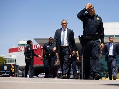Dallas Police Chief Eddie García walks to talk to the press as Dallas police investigate...