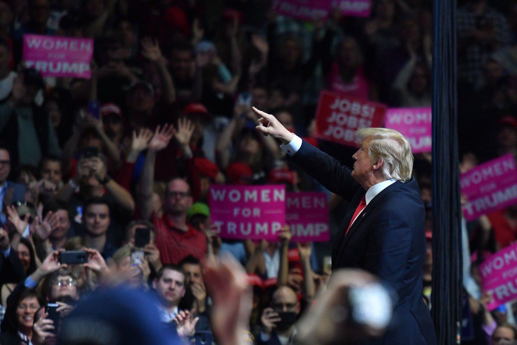 U.S. President Donald Trump points to supporters during a campaign rally in Grand Rapids, Michigan on March 28, 2019. 