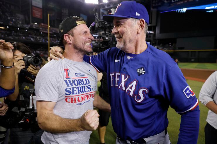 Texas Rangers starting pitcher Max Scherzer (left) and manager Bruce Bochy celebrate their...