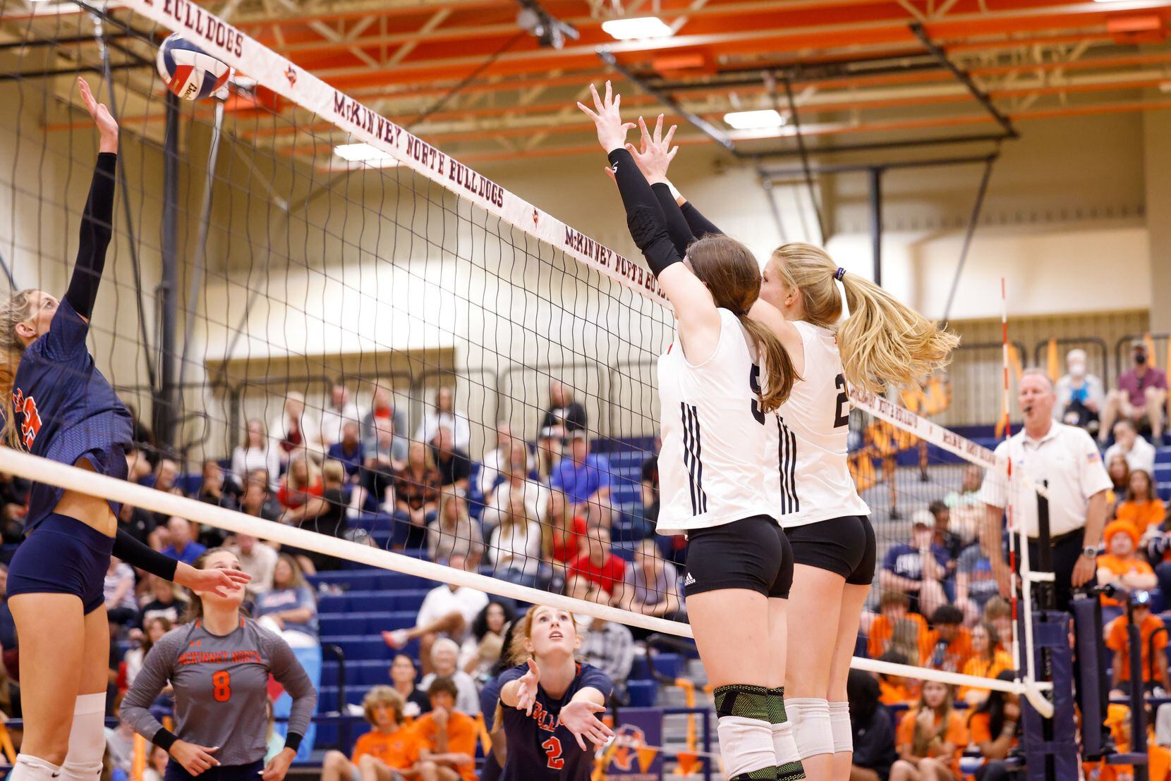 McKinney North Natalie Hughes (19) reaches for a spike in the final set of a match against...