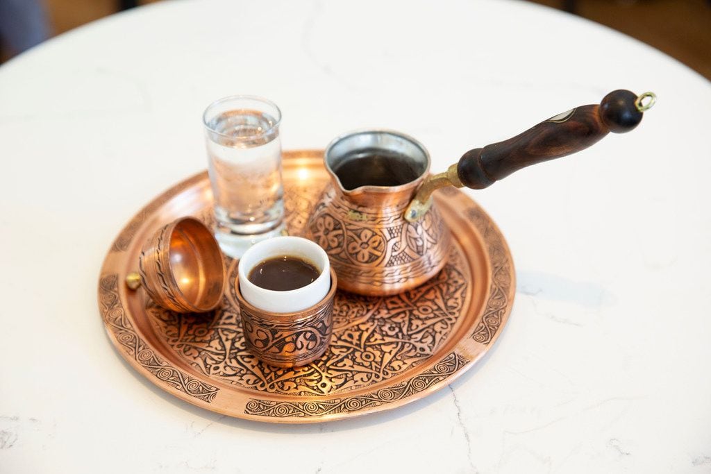 Turkish Coffee at Pax & Beneficia is served on plates sourced from Turkey.