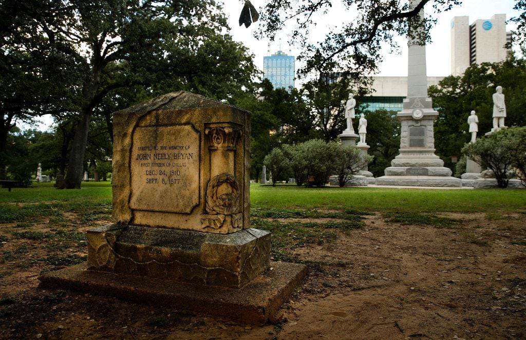 The John Neely Bryan memorial stands before the Confederate War Memorial in Pioneer Park...