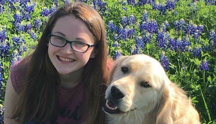 Hannah Westmoreland with her service dog, Journey.