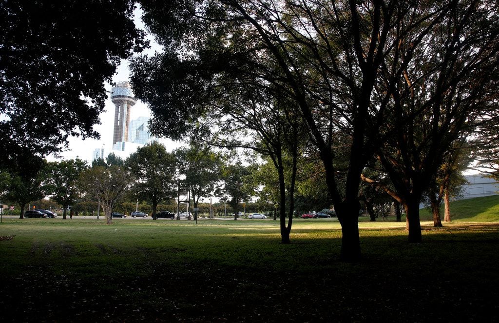 Reunion Tower is seen through the trees as downtown traffic heads west toward Stemmons...