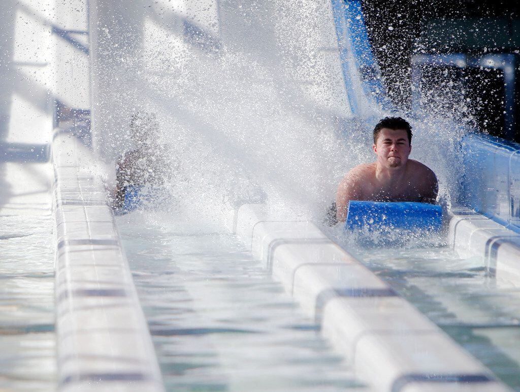 Ethan Walters goes down a slide at Epic Waters Indoor water park in Grand Prairie.