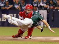 Prosper’s Harrison Rosar (10) is tagged out by Coppell catcher Walker Polk (23) at home...