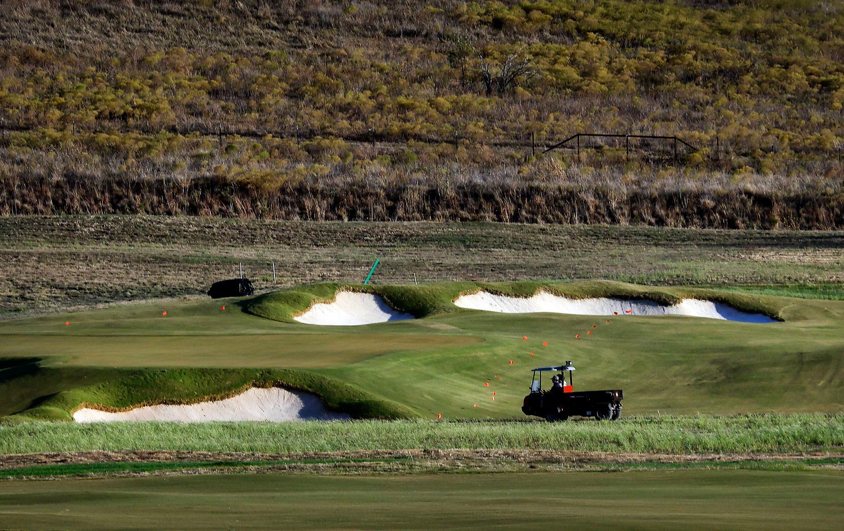 Bunkers surround a green on one of the courses at the new PGA of America Headquarters under...
