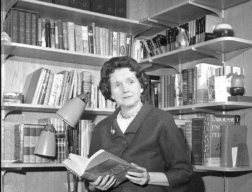  Rachel Carson  holds her book Silent Spring in the library of her Silver  Spring, Md., home...