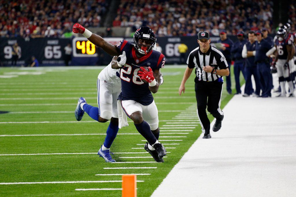 HOUSTON, TX - JANUARY 05:  Alfred Blue #28 of the Houston Texans rushes the ball forced out...