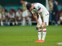 Christian Pulisic of the United States is dejected after the World Cup round of 16 soccer...