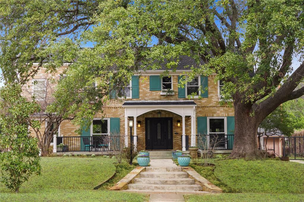 A traditional home sits on a large lot in Oak Cliff.