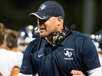 Argyle Liberty Christian Head Coach Jason Witten encourage his players after scoring a...