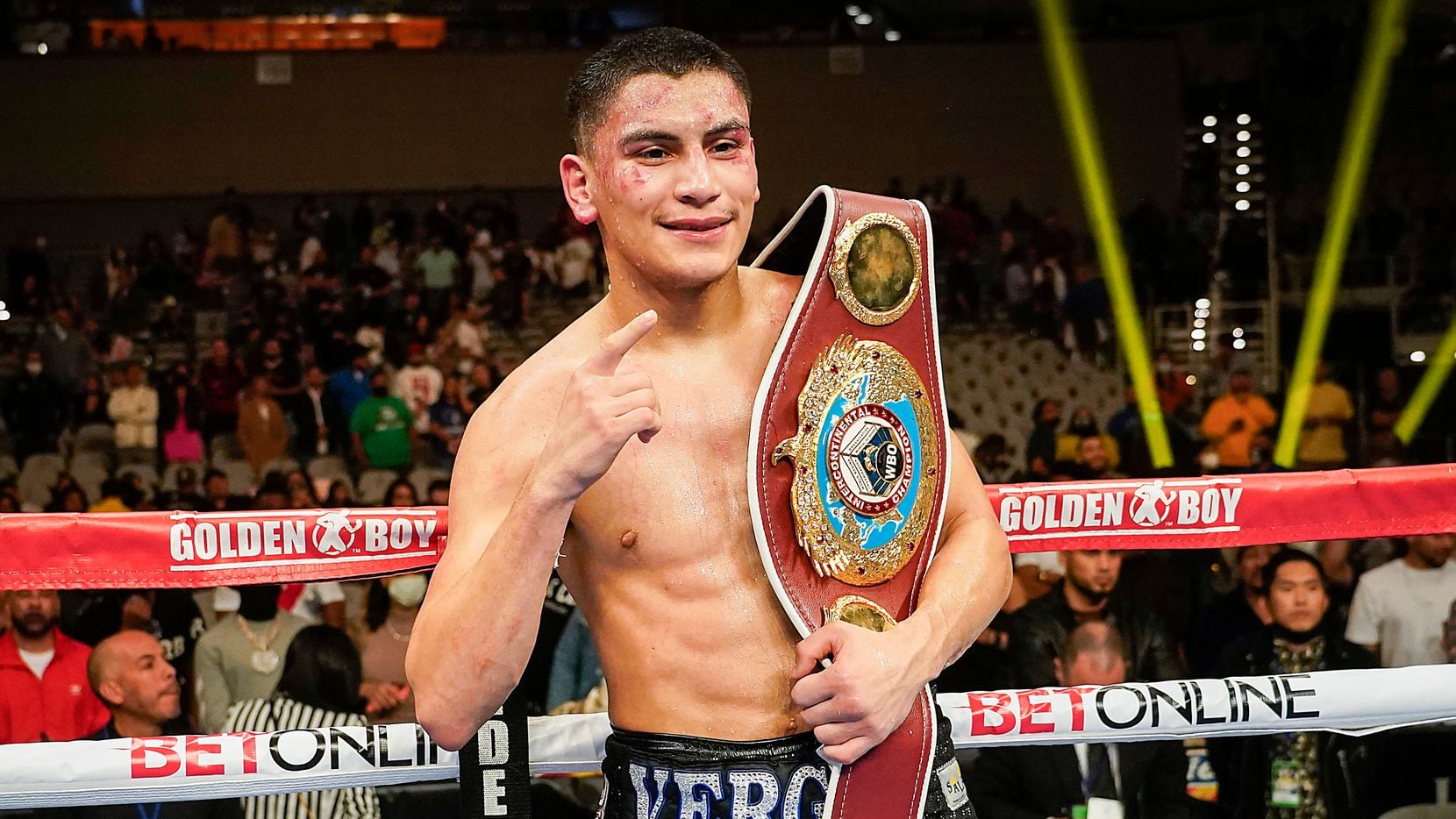 Vergil Ortiz Jr. celebrates with the title belt after knocking out Maurice Hooker in the...