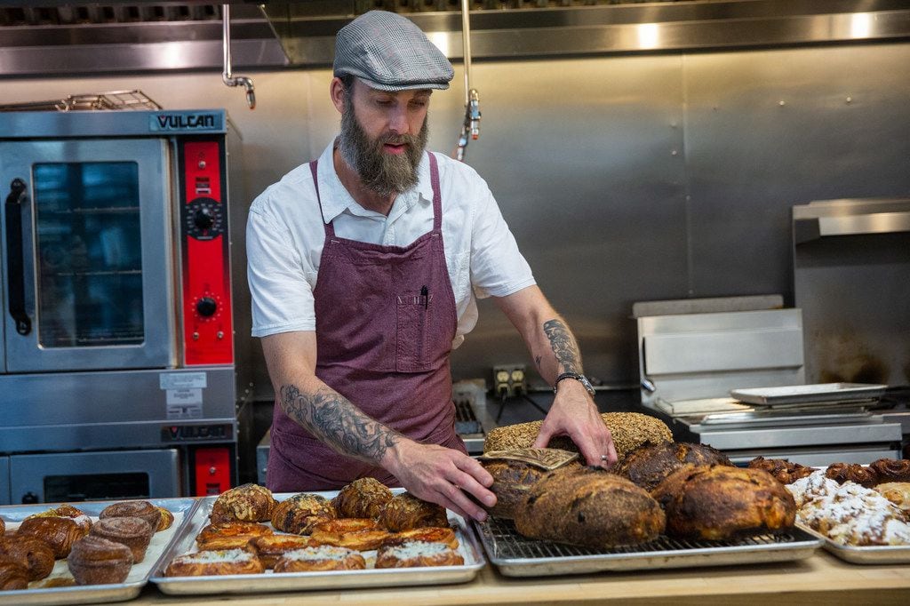 Matt Bresnan, head chef at Food Company, arranges baked goods in the Nonna kitchen in Highland Park in Dallas. 