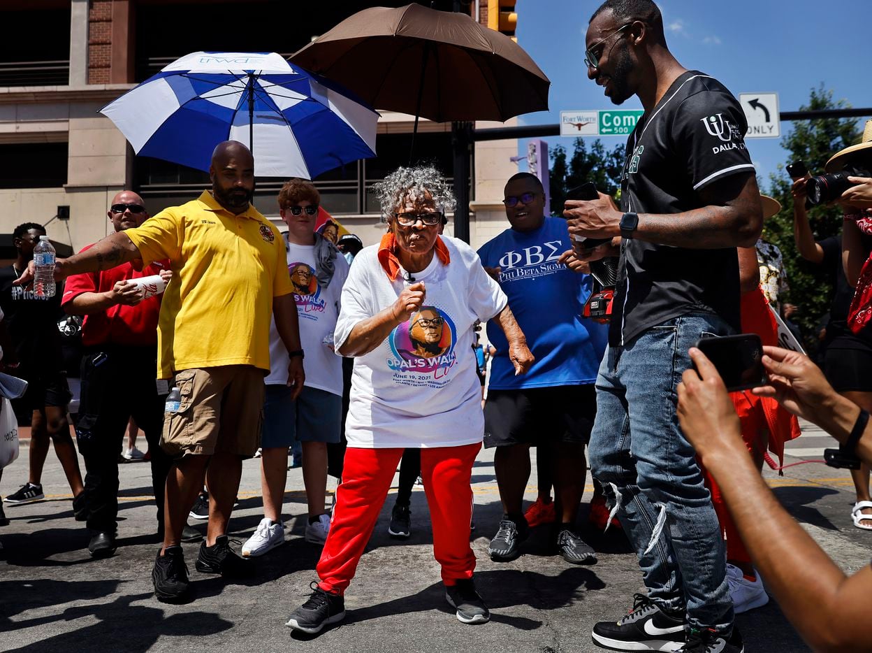 During her walk through downtown Fort Worth, Opal Lee (center) stopped in the middle of...