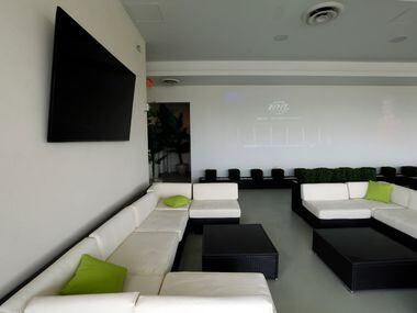Owner Phil Romano is opening a new covered rooftop lounge with large televisions (left) and...