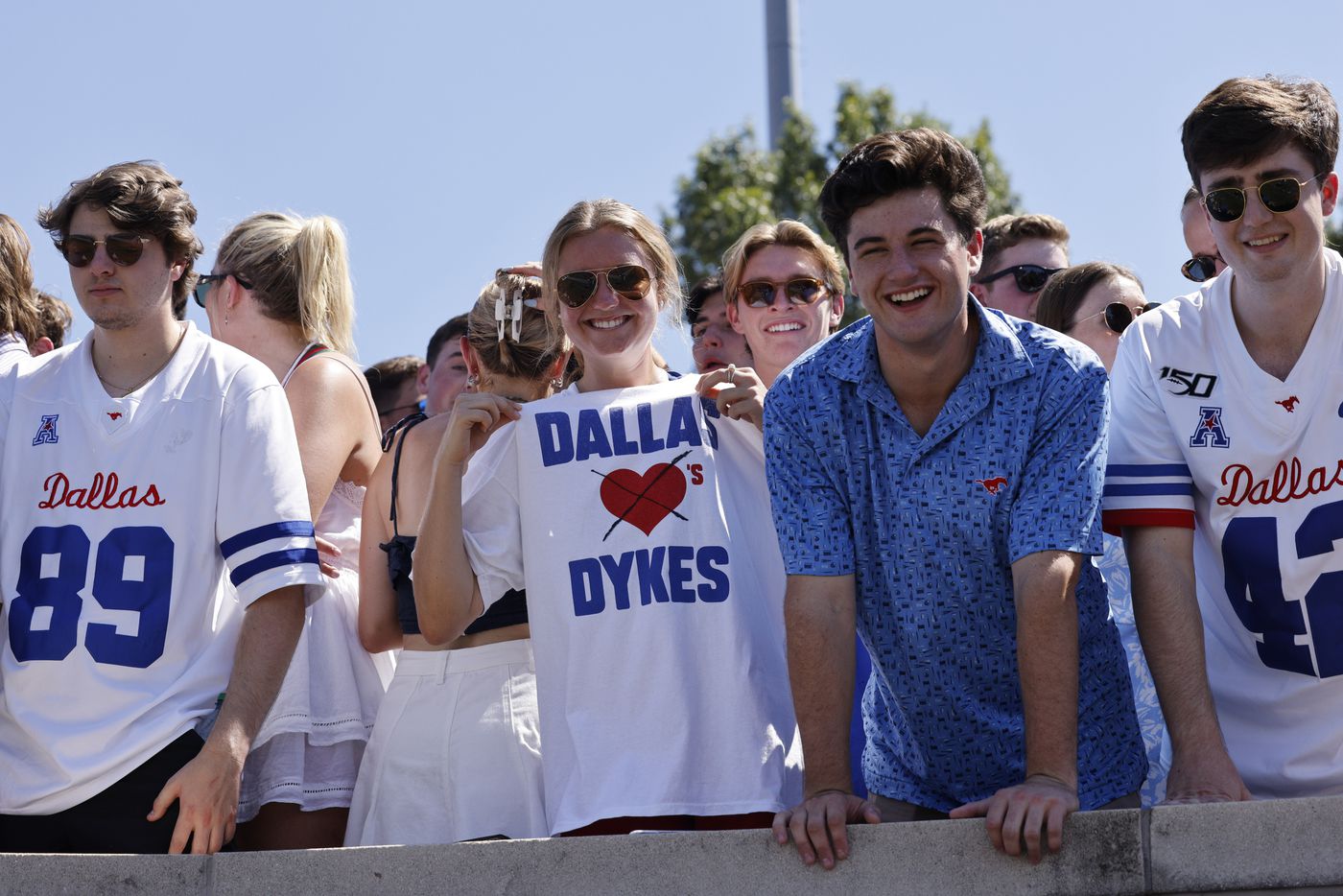 A fan shows off her modified Dallas loves Dykes” shirt during the second half of a game at...