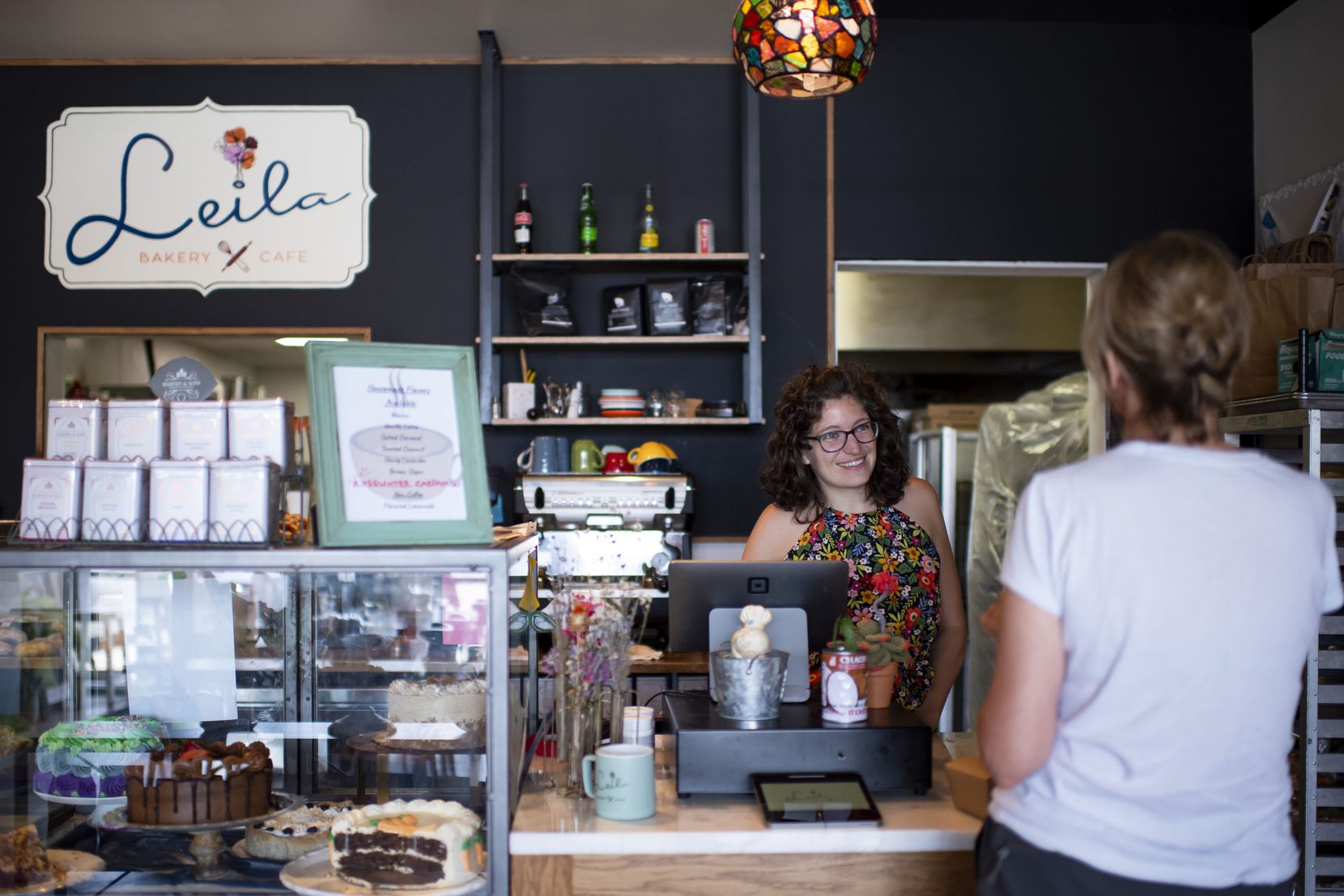 Kelly Ball converses with a customer at Leila Bakery & Cafe in Dallas, Texas on Saturday,...