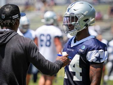Dallas Cowboys cornerback Kelvin Joseph (24) works with defensive backs coach Al Harris during a practice at training camp on Tuesday, July 27, 2021, in Oxnard, Calif.
