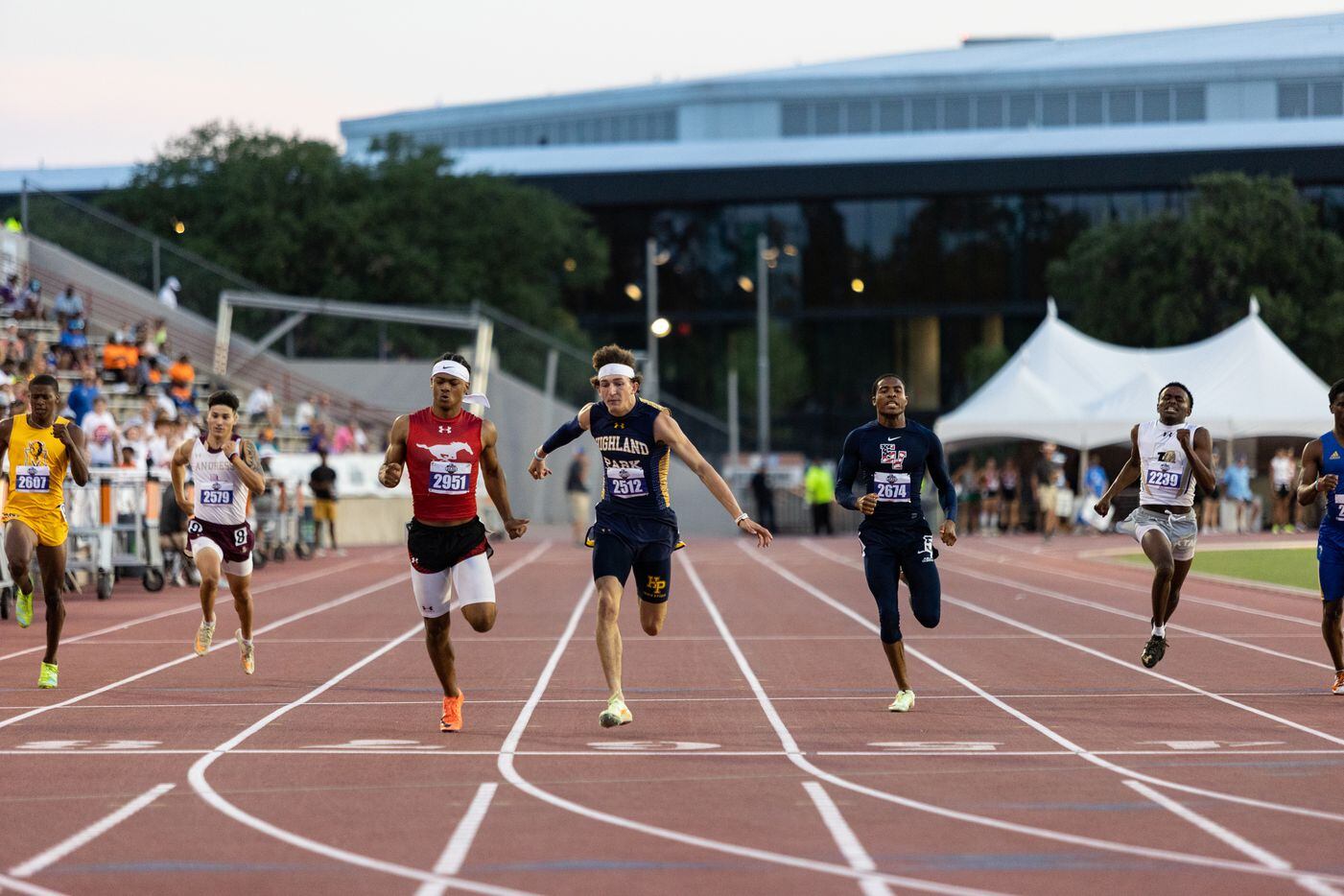 John Rutledge of Dallas Highland Park runs to the finish line during the boys’ 200m dash at...