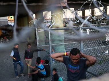 Migrants, including young children and babies, at the U.S. Border Patrol temporary holding...