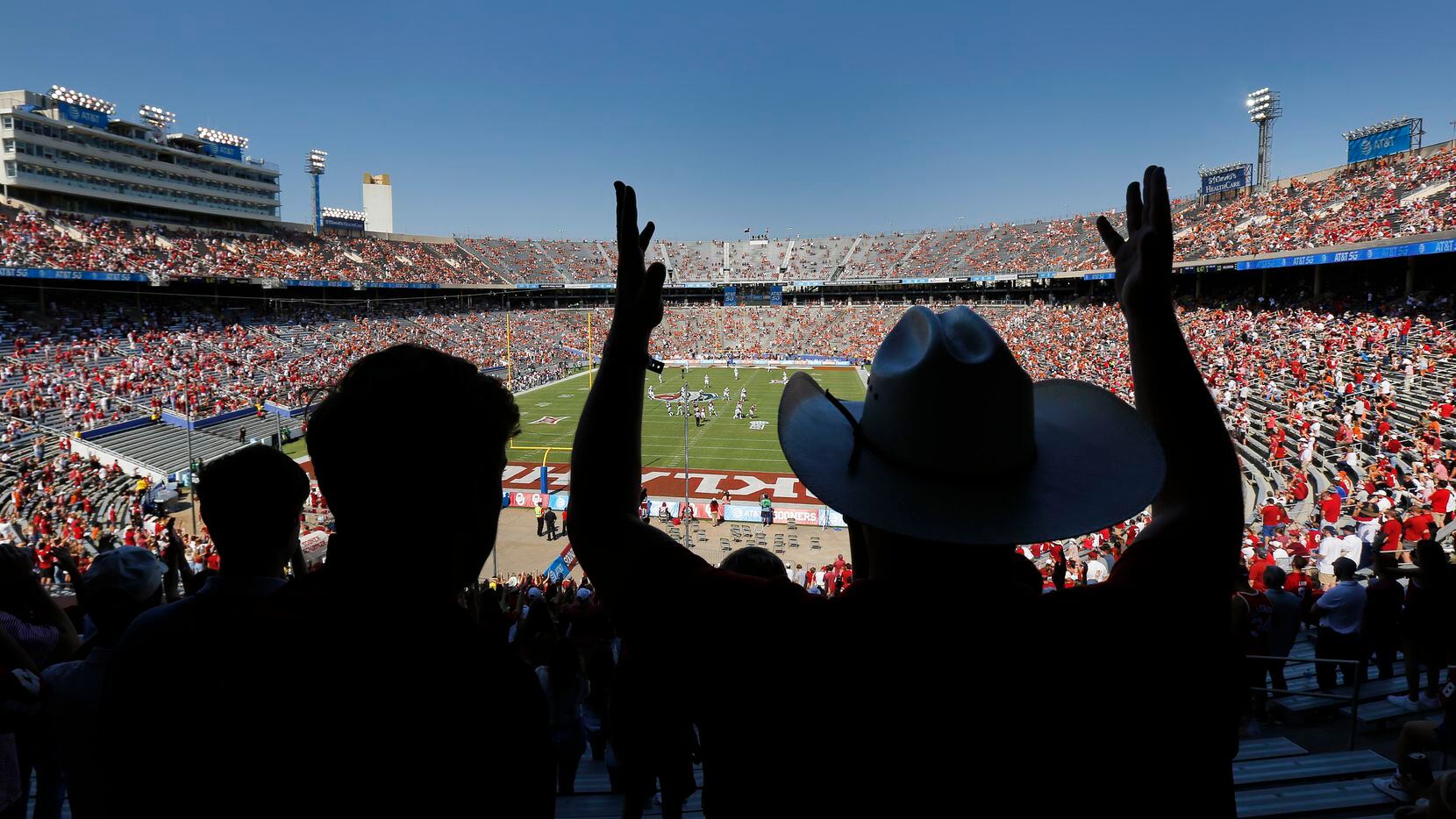 FILE -- University of Oklahoma student Beau Baggett (right) forms the letters OU as the...