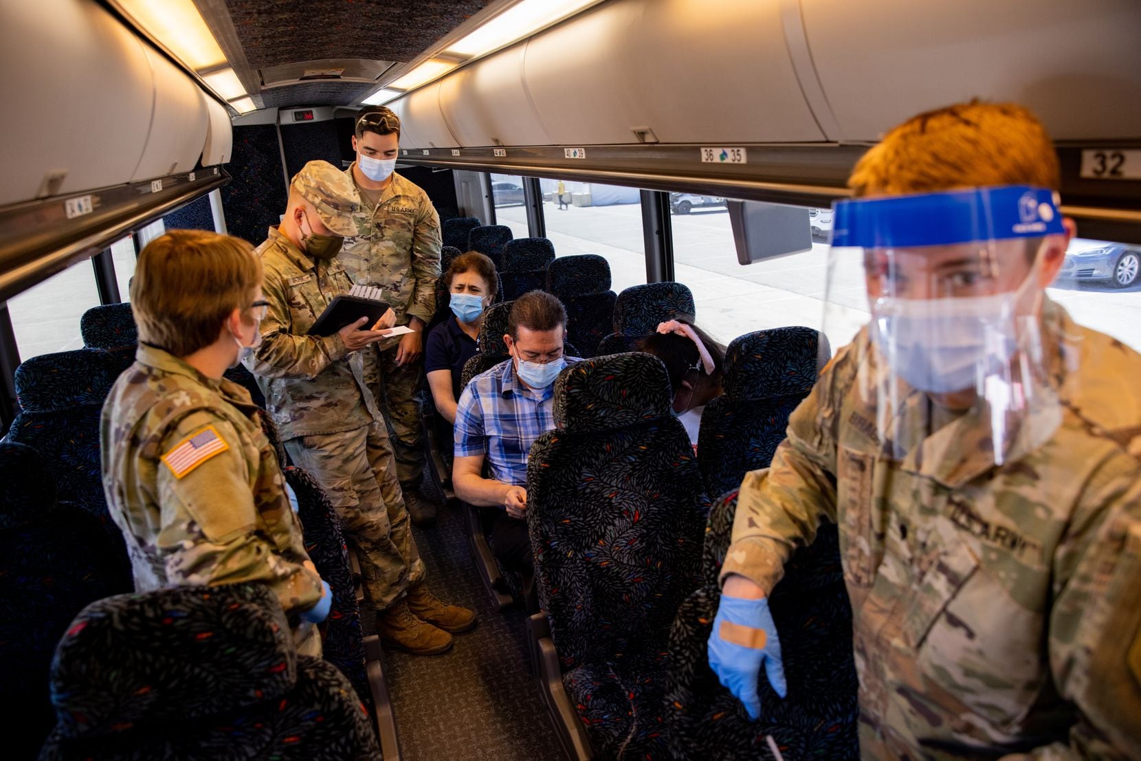 U.S. Army troops prepare to administer the COVID-19 vaccine at Fair Park through the "Registration and Transportation" effort by Dallas County that bused people from Bachman Recreation Center.