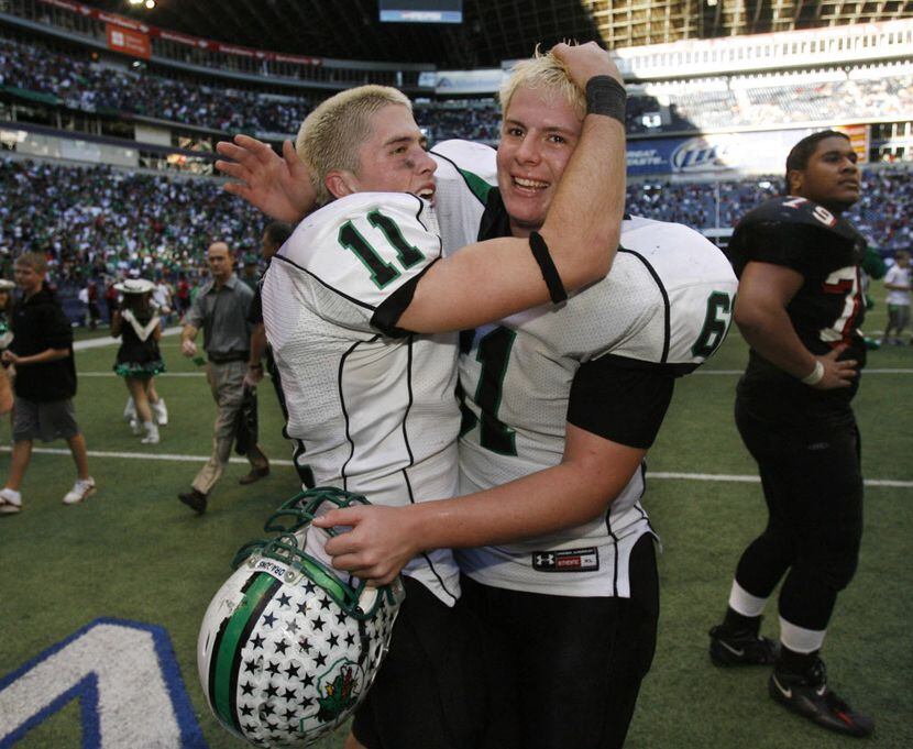 Southlake Carroll quarterback Riley Dodge (11) and center Nick Leppo celebrate after the...