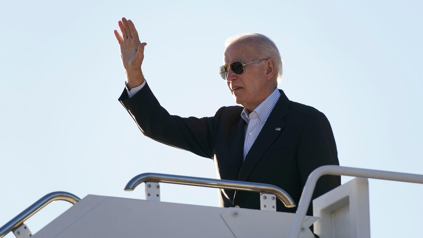 FILE - President Joe Biden waves before boarding Air Force One at El Paso International...
