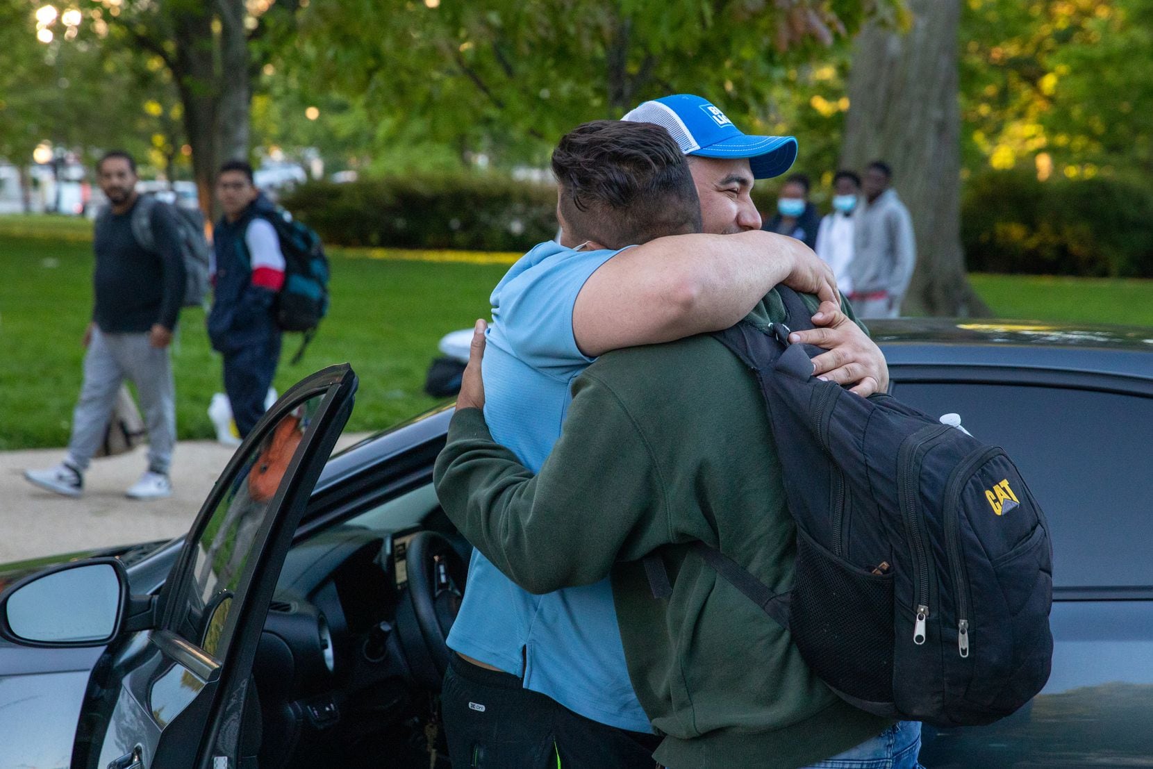Nemies Rubio, left, embraces his friend Hector Granadillo, who came to the United States...