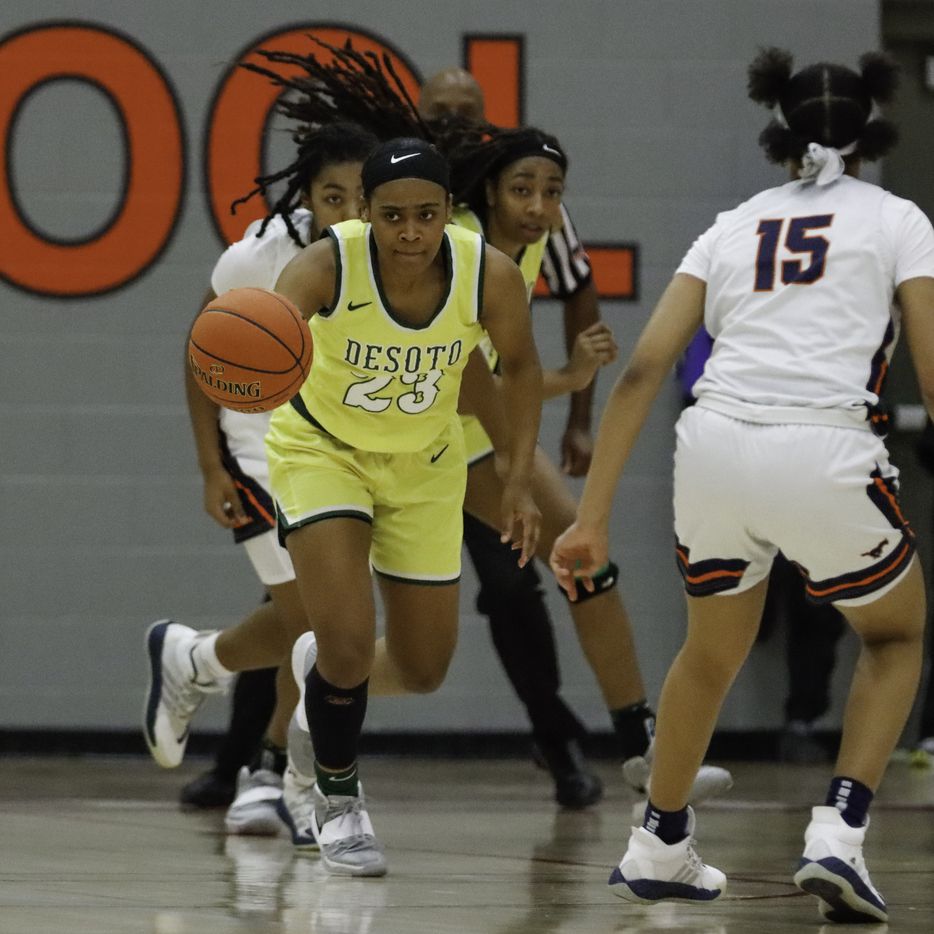 DeSoto’s Kendall Brown (23) pushes the ball past Sachse’s Londyn Oliphant (15) during the...