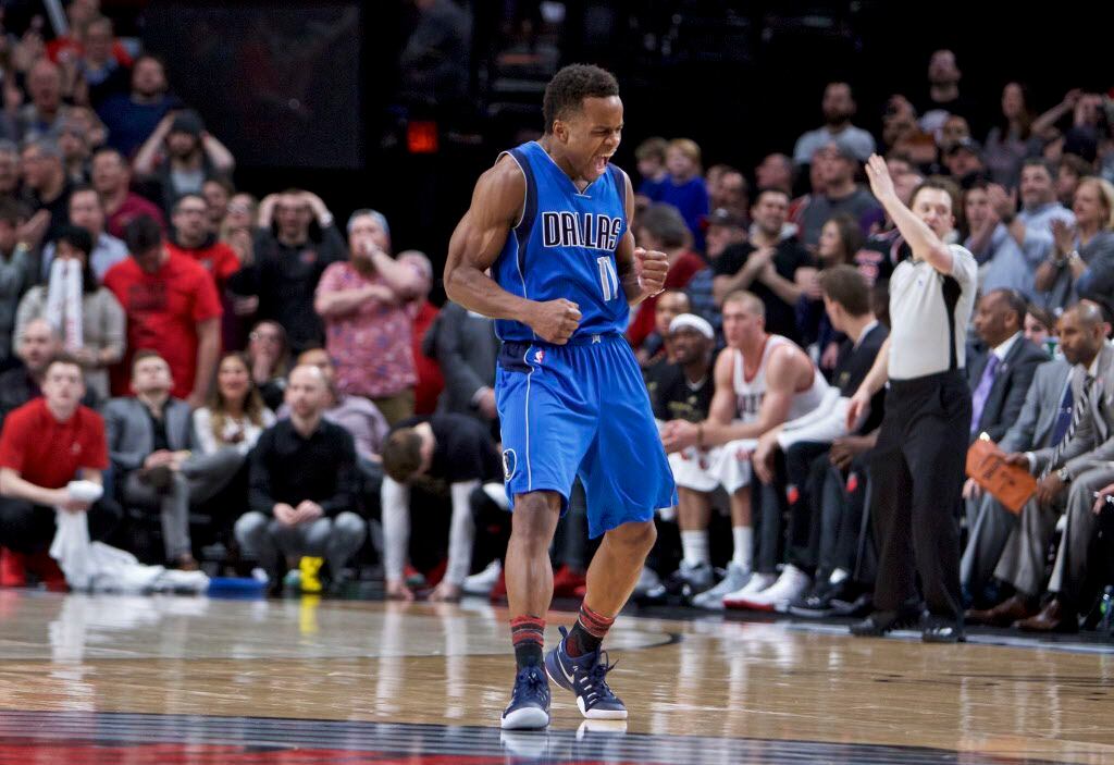 Dallas Mavericks guard Yogi Ferrell reacts after making a 3-point basket against the...