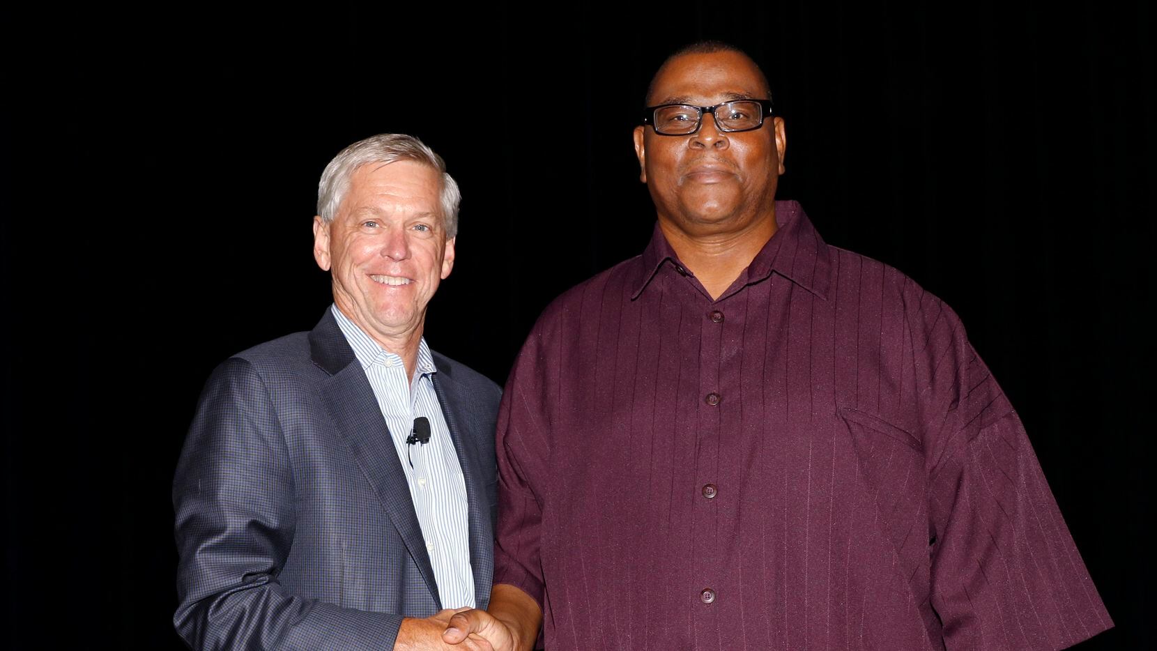 Publisher Jim Moroney (left) honored Thomas Ellison for his 15 years of service to The Dallas Morning News in June 2015.
