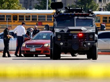 Police officials work the scene of a school shooting at Mansfield Timberview High School in Arlington, Texas, Wednesday, October 6, 2021. Four people were injured inside the school and transported to area hospitals. The shooter is still at-large. (Tom Fox/The Dallas Morning News)