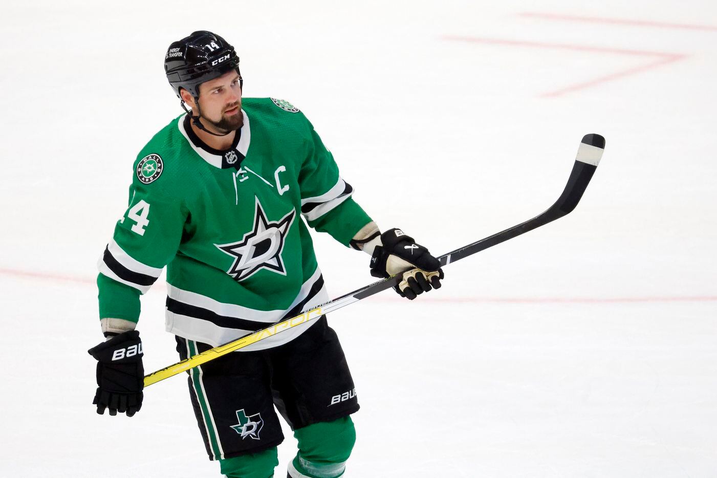Dallas Stars left wing Jamie Benn (14) skates to the penalty box after an overtime penalty...