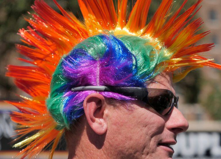 Scott Roberts sports a rainbow mohawk wig at the Pride Parade and Pride Street Festival in...