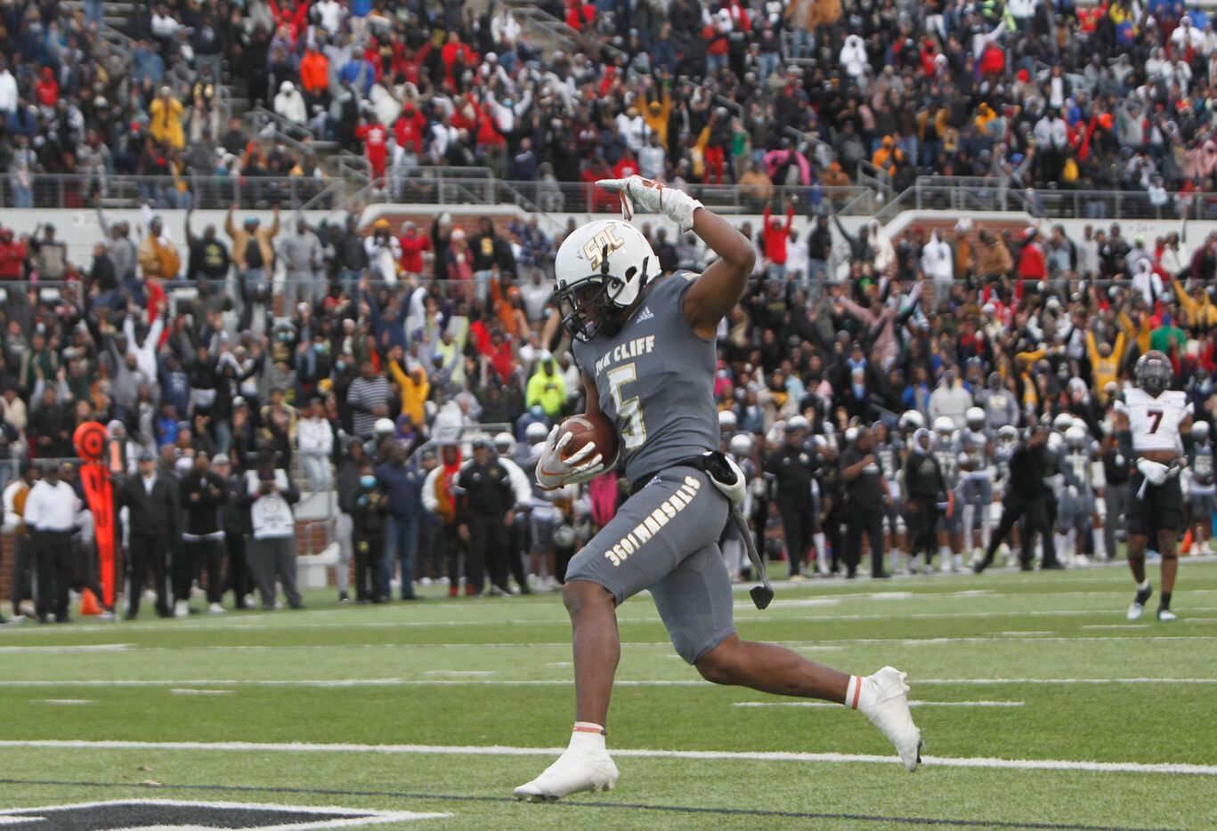 South Oak Cliff receiver Randy Reece (5) ignites Golden Bears fans as he breaks away for a game winning reception during the 4th quarter of play against Aledo. South Oak Cliff won 33-28 to advance. The two teams played their Class 5A Division ll Region ll semifinal football game at Vernon Newsom Stadium in Mansfield on November 26, 2021. (Steve Hamm/ Special Contributor)