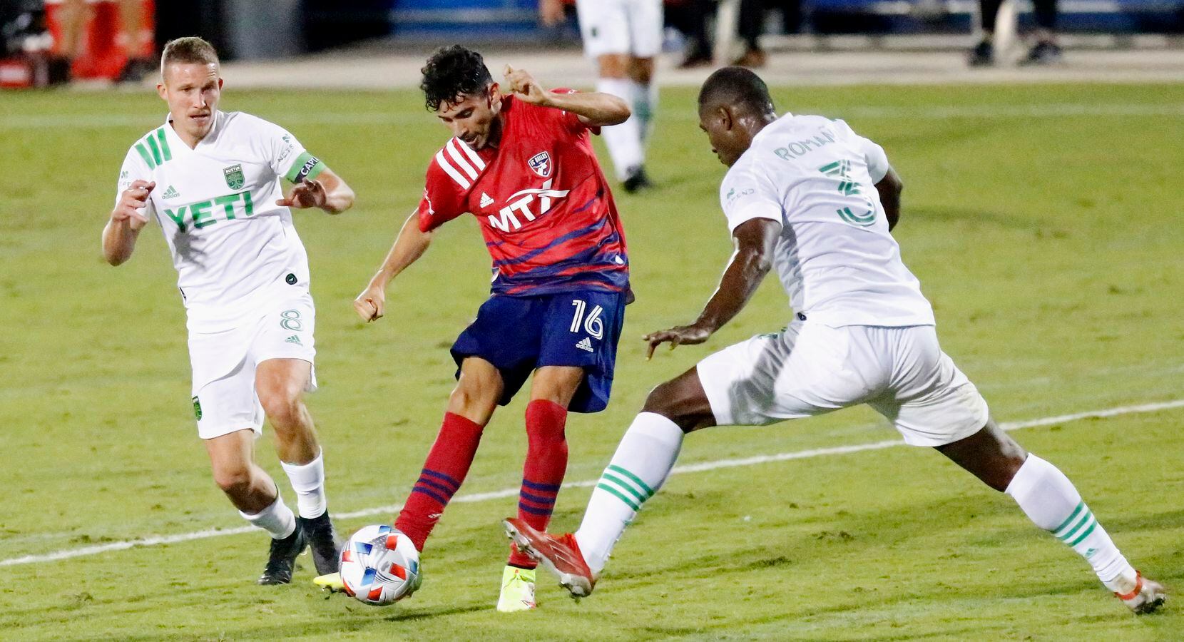 FC Dallas forward Ricardo Pepi (16) shoots between Austin FC midfielder Alexander Ring (8) and Austin FC defender Jhohan Romana (3) during the second half as FC Dallas hosted Austin FC at Toyota Stadium in Frisco on Saturday, October 30, 2021. (Stewart F. House/Special Contributor)