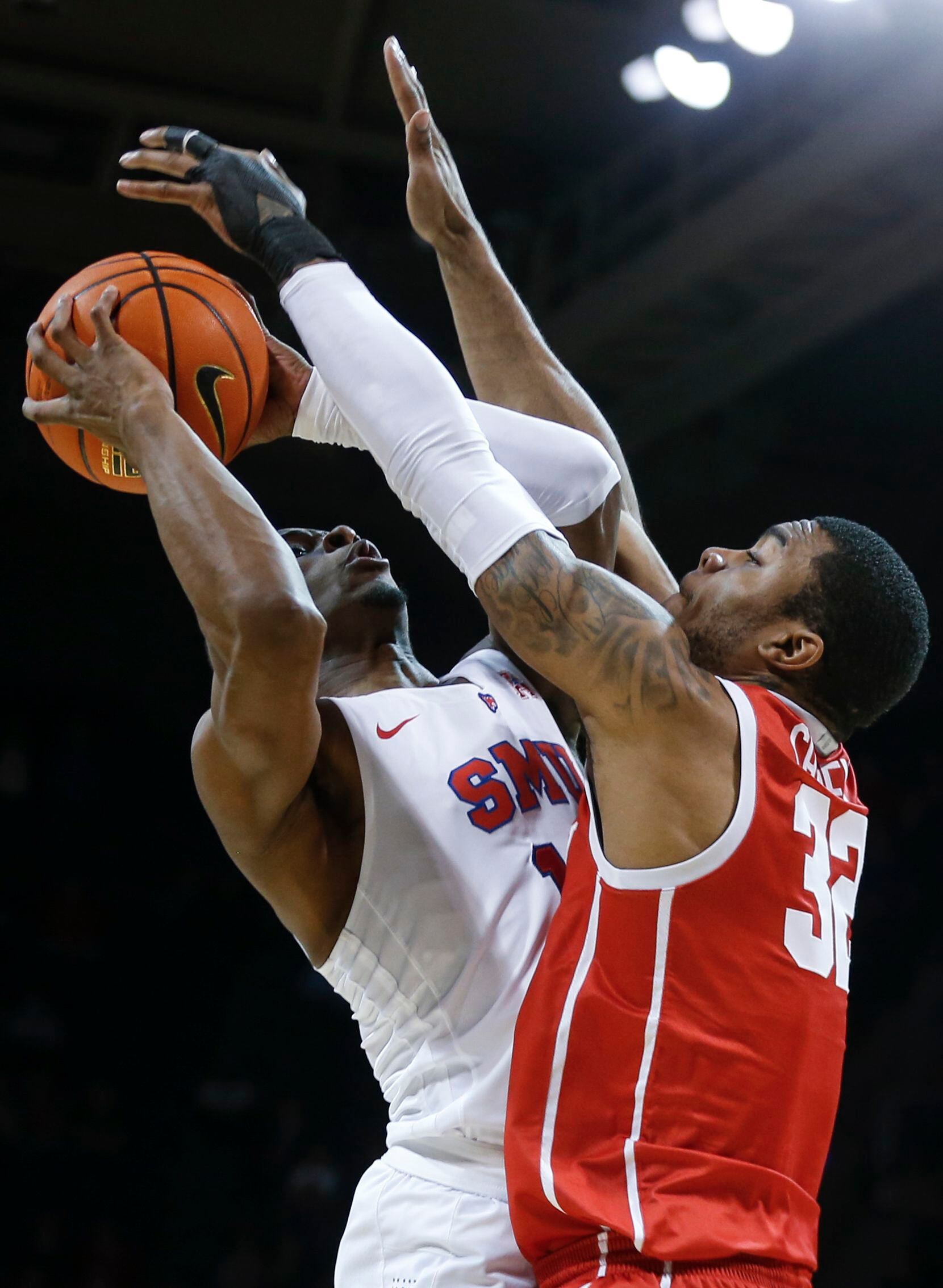 Southern Methodist Mustangs guard Zach Nutall (10) jumps with the ball to shoot while...