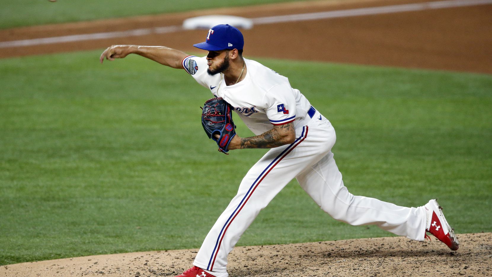 FILE - Rangers relief pitcher Jonathan Hernandez (72) delivers a pitch against the Oakland...