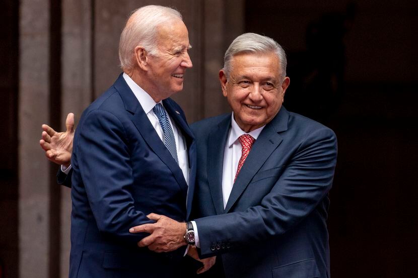 President Joe Biden is greeted by Mexican President Andres Manuel Lopez Obrador as he...