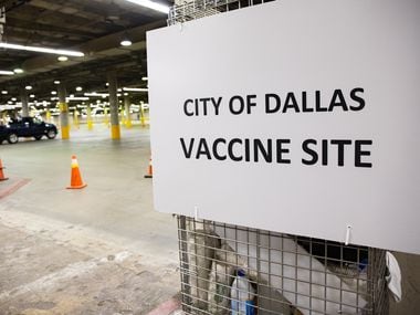 A sign for the drive-up vaccine clinic at Kay Bailey Hutchison Convention Center in Dallas on Wednesday, Jan. 27, 2021. (Juan Figueroa/ The Dallas Morning News)