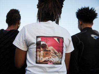 Ashuntae Coleman, 14, wears a t-shirt in memory of her childhood friend during the ...